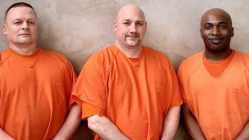 The three inmate heroes pose for a photo